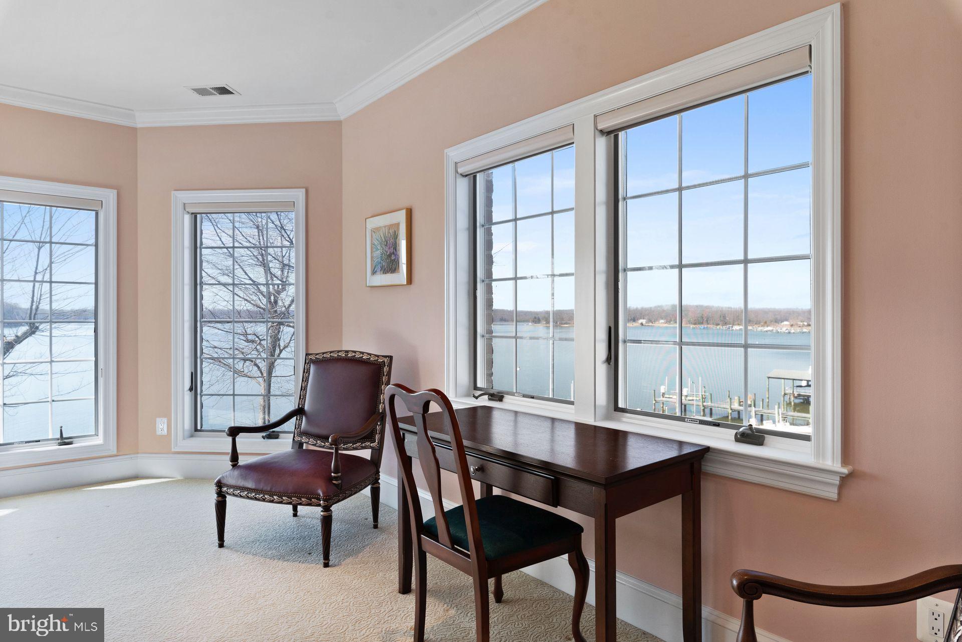 4132 Cadle Creek Road Edgewater, MD 21037 - Photo 42 of 85 a dining room with furniture and windows