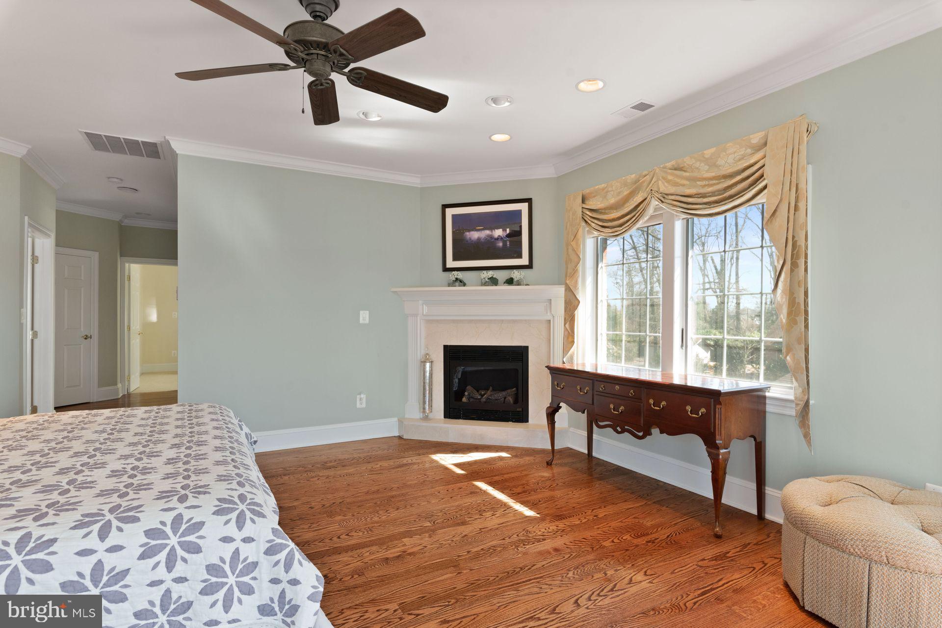 4132 Cadle Creek Road Edgewater, MD 21037 - Photo 45 of 85 a living room with furniture and a fireplace