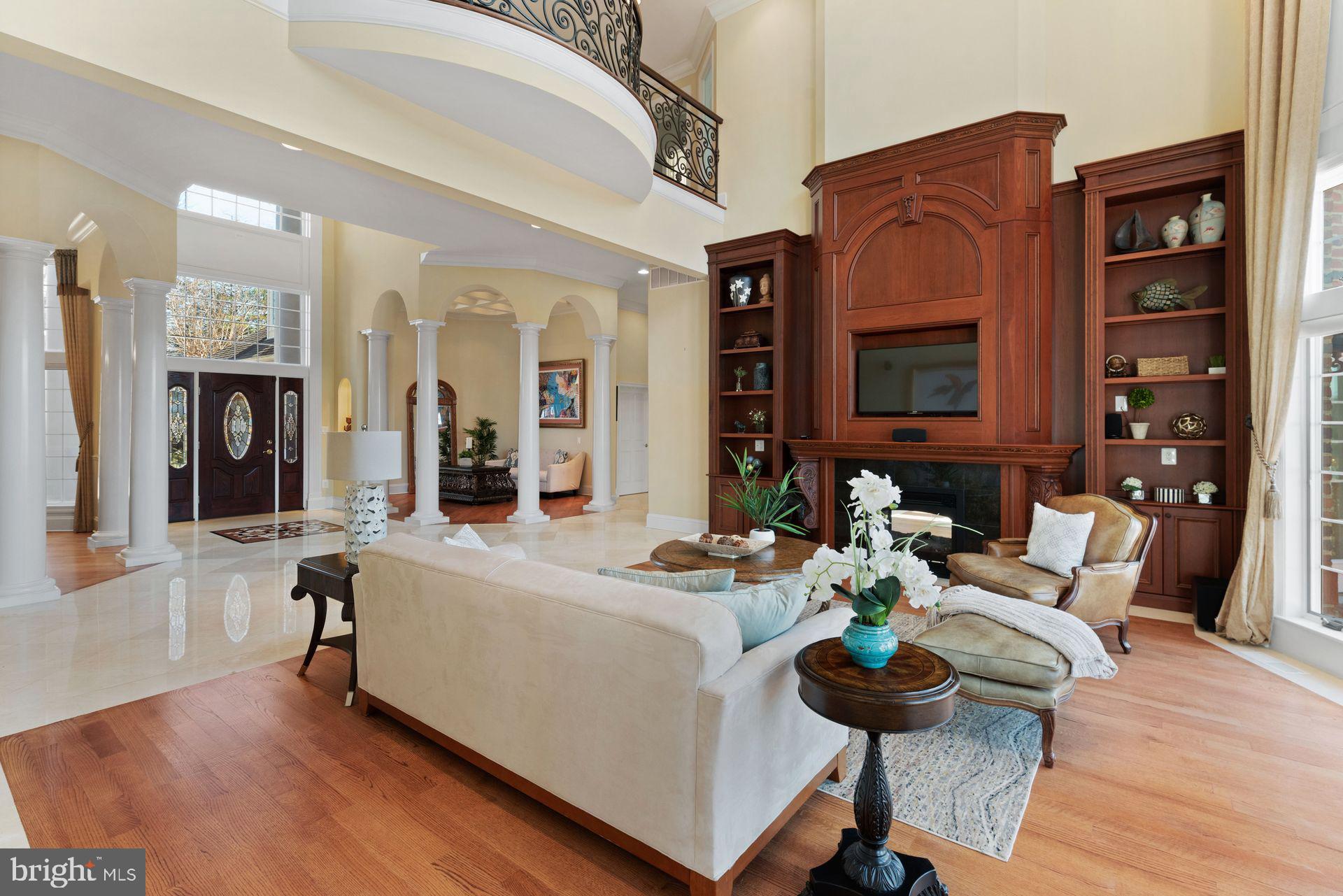 4132 Cadle Creek Road Edgewater, MD 21037 - Photo 6 of 85 a living room with fireplace furniture and a flat screen tv
