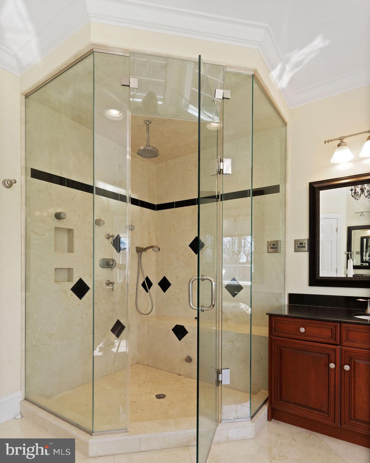 4132 Cadle Creek Road Edgewater, MD 21037 - Photo 51 of 85 a bathroom with a glass shower door and a sink