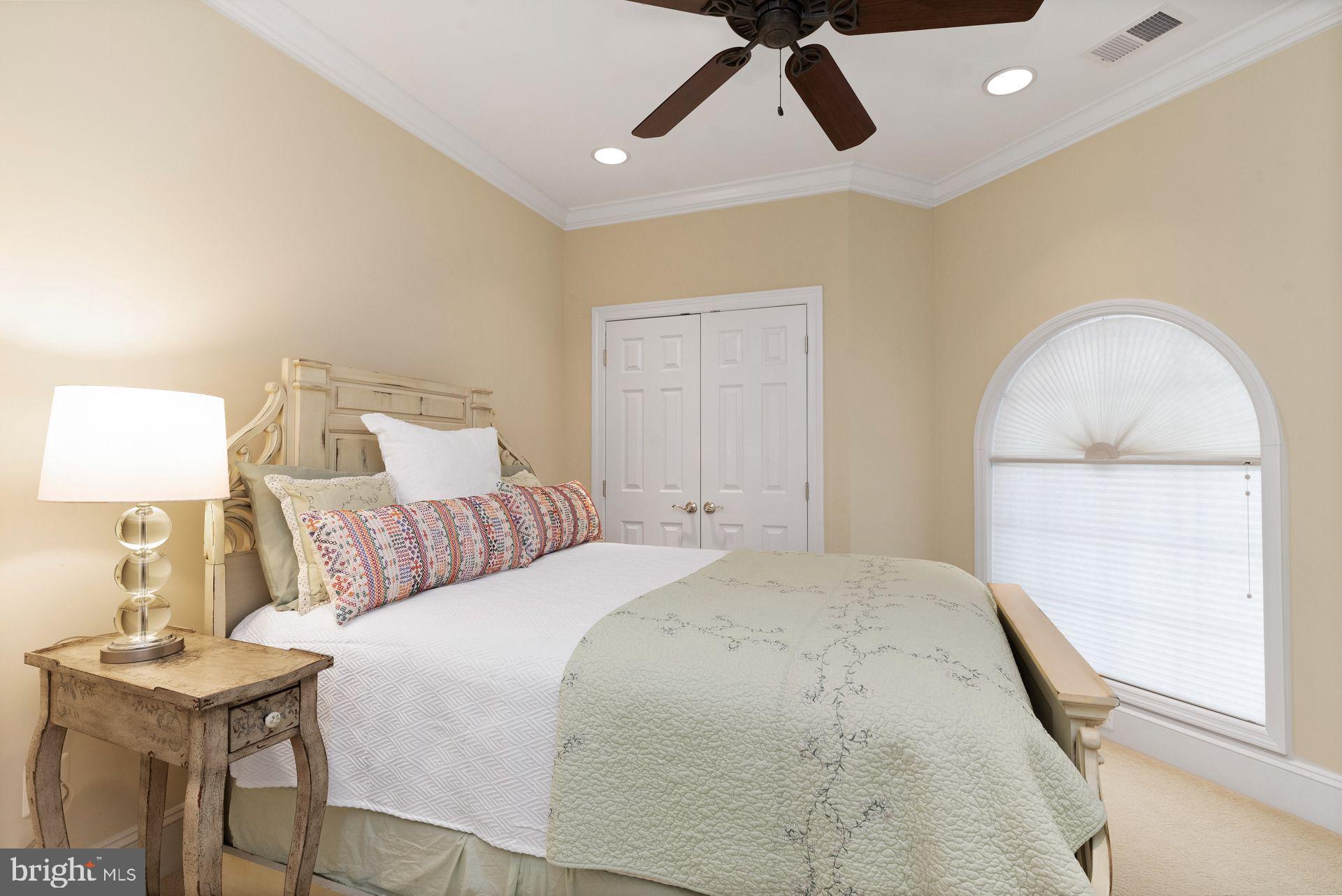 4132 Cadle Creek Road Edgewater, MD 21037 - Photo 53 of 85 a bedroom with a bed and a table