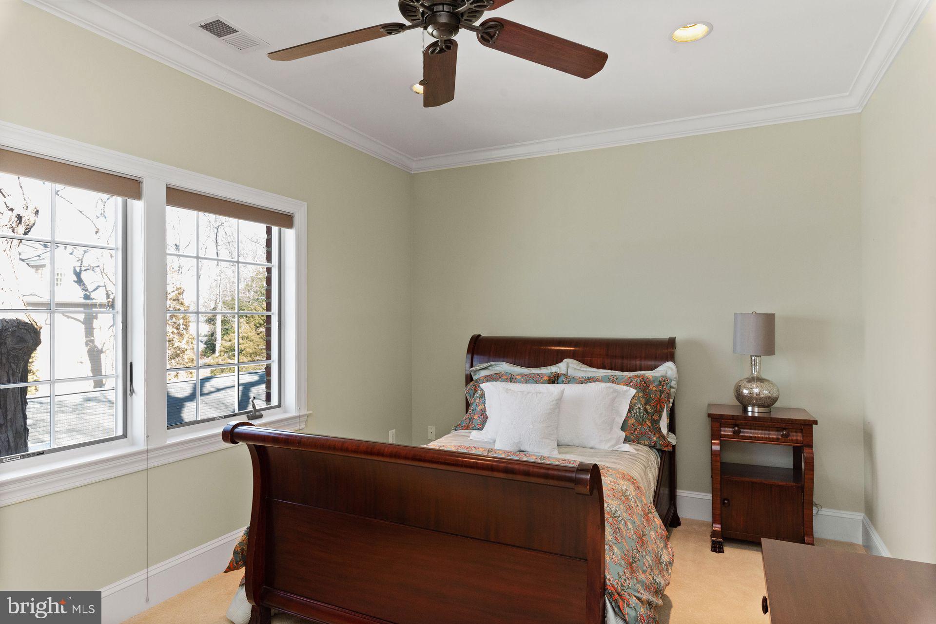 4132 Cadle Creek Road Edgewater, MD 21037 - Photo 54 of 85 a bedroom with a bed and a window