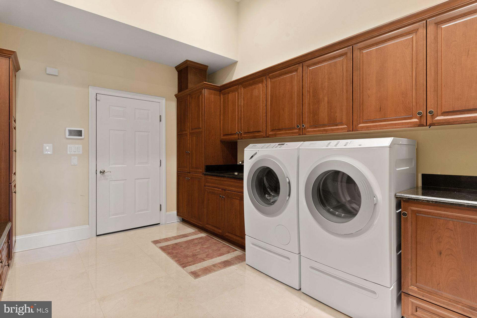 4132 Cadle Creek Road Edgewater, MD 21037 - Photo 57 of 85 a utility room with dryer and washer