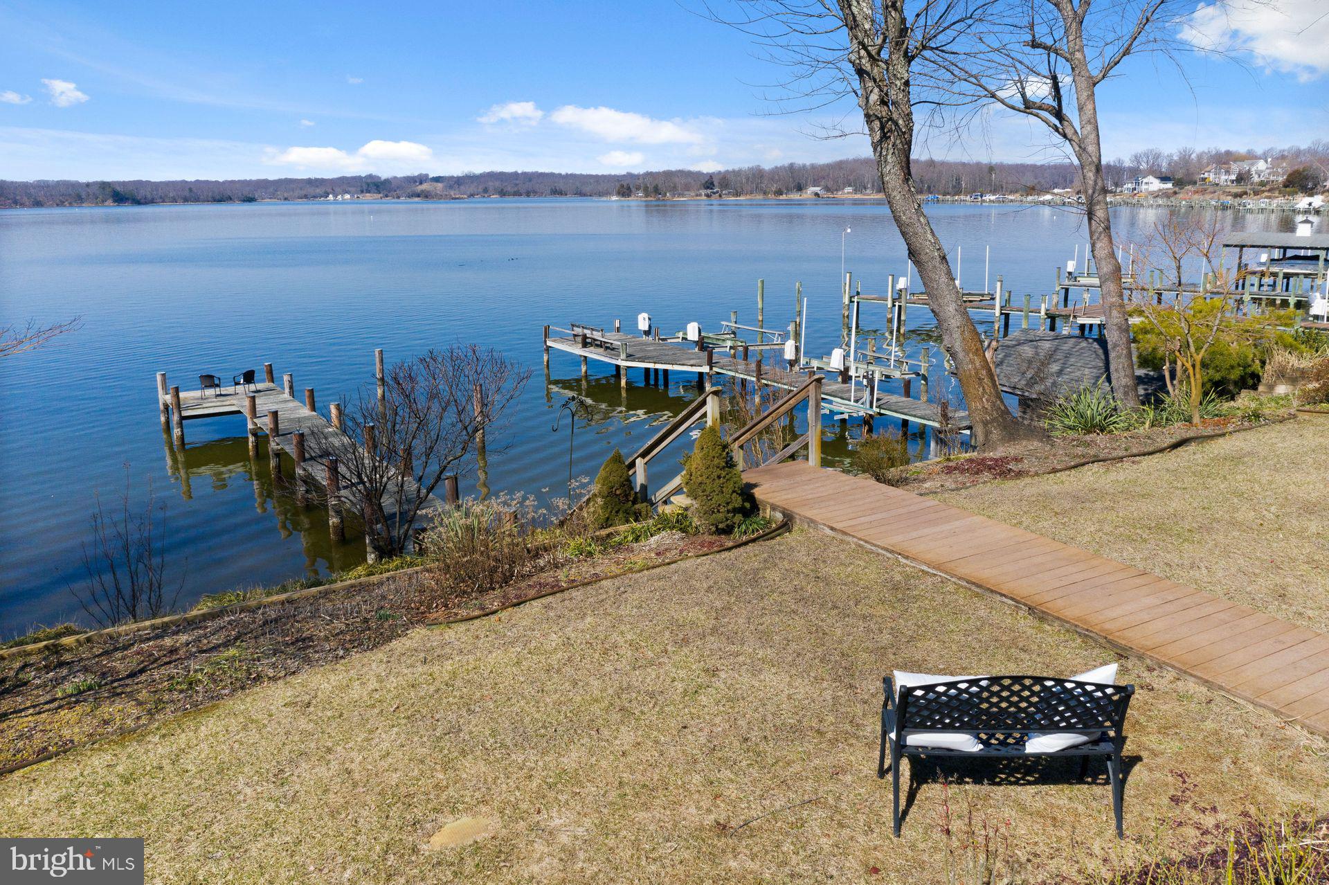4132 Cadle Creek Road Edgewater, MD 21037 - Photo 67 of 85 a view of a lake with a palm tree