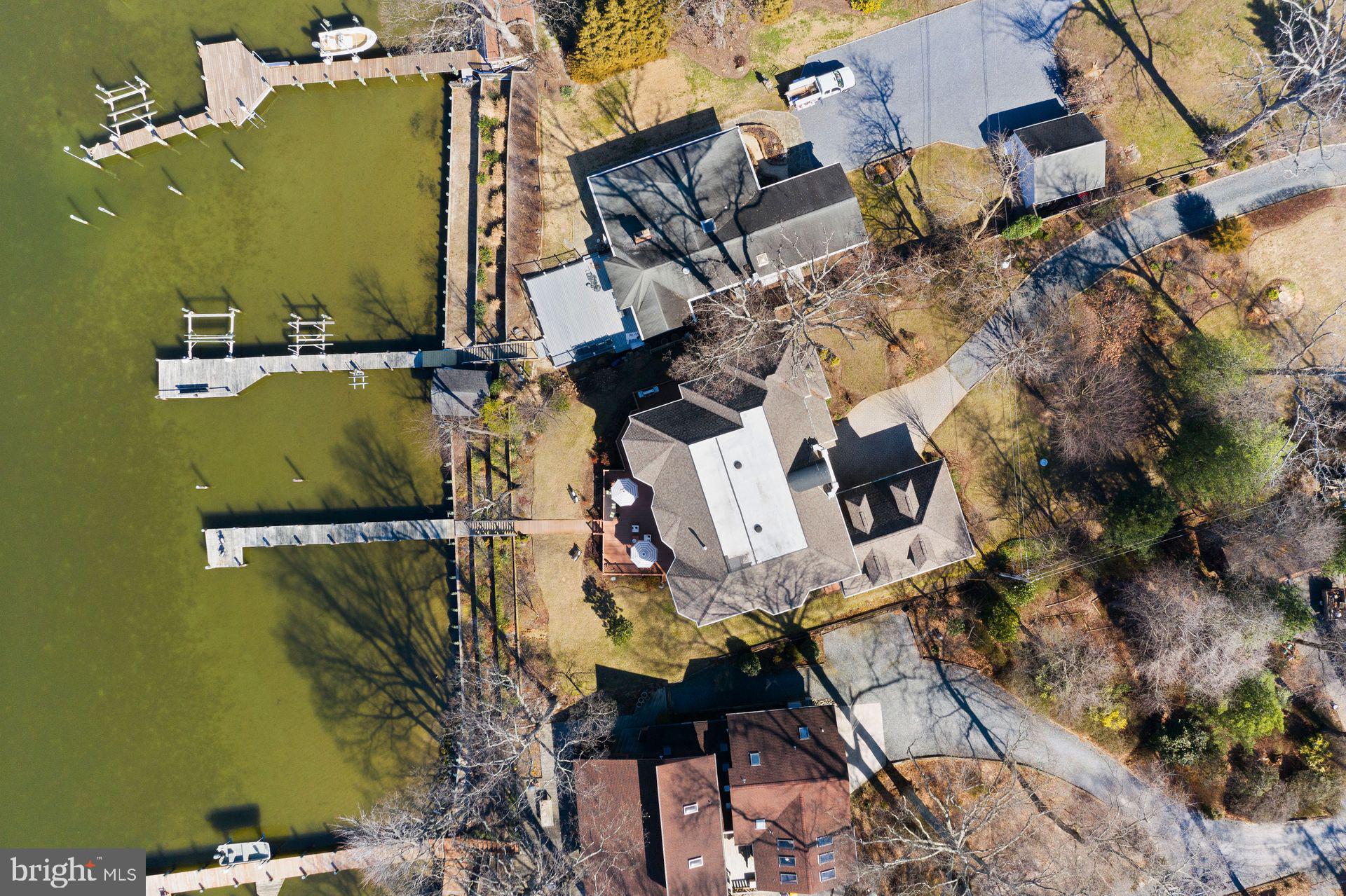 4132 Cadle Creek Road Edgewater, MD 21037 - Photo 75 of 85 an aerial view of a house with a yard