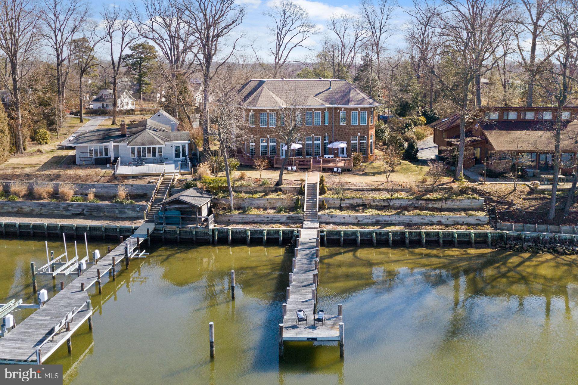 4132 Cadle Creek Road Edgewater, MD 21037 - Photo 80 of 85 a view of a lake with a house swimming pool and outdoor space