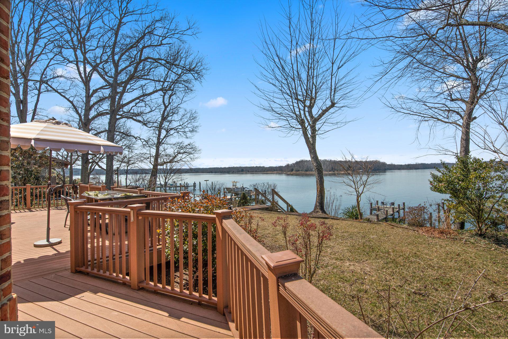 4132 Cadle Creek Road Edgewater, MD 21037 - Photo 85 of 85 a view of a roof deck with wooden fence and floor