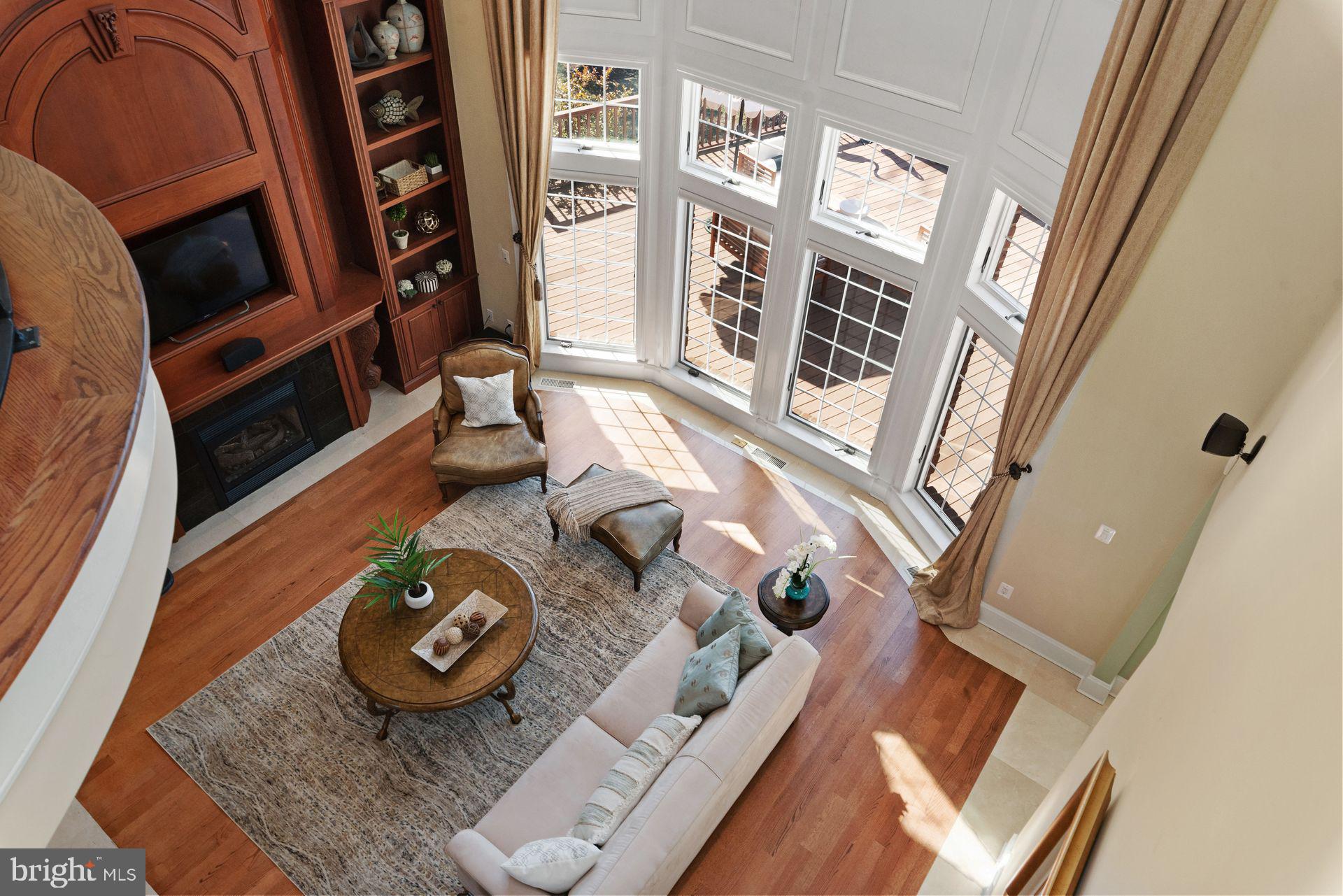 4132 Cadle Creek Road Edgewater, MD 21037 - Photo 10 of 85 a living room with furniture and a floor to ceiling window