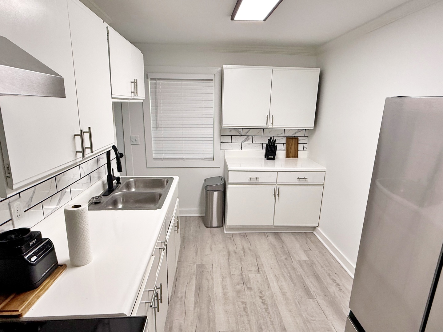 116 Oak Drive Metropolis, IL 62960 - Photo 12 of 38 a kitchen with a sink a stove and cabinets