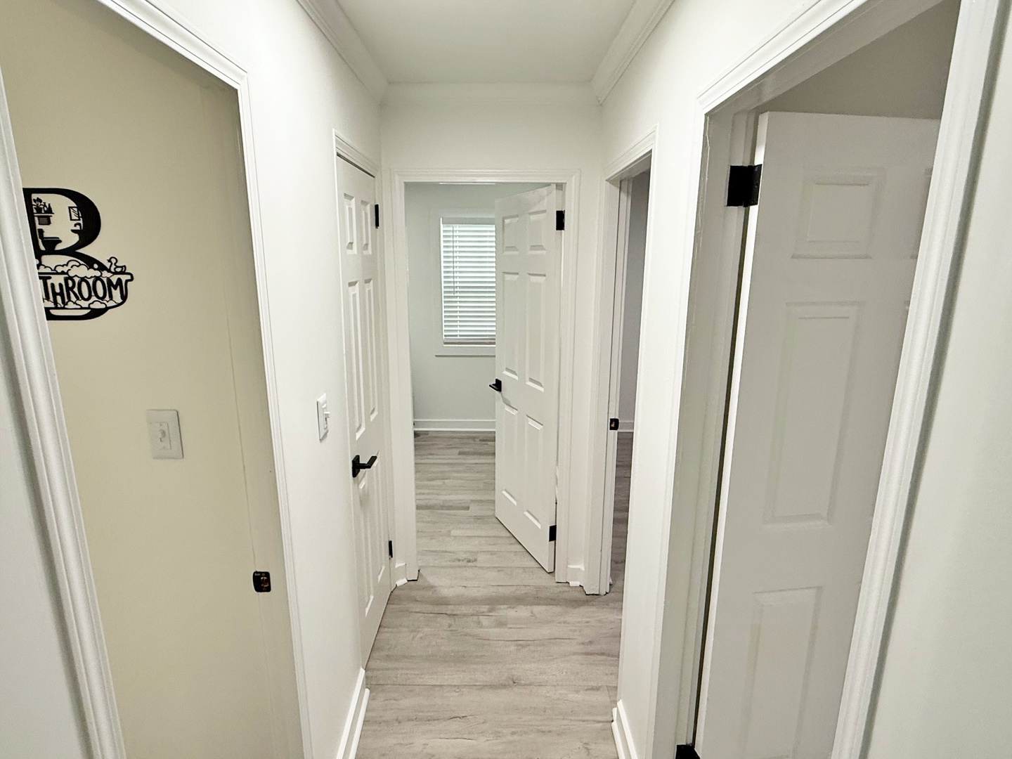 116 Oak Drive Metropolis, IL 62960 - Photo 21 of 38 a view of a hallway with wooden floor and staircase
