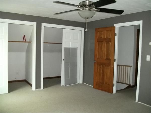 2 Hickory Drive Rutland, MA 01543 - Photo 8 of 30 a view of empty room with wooden floor and ceiling fan