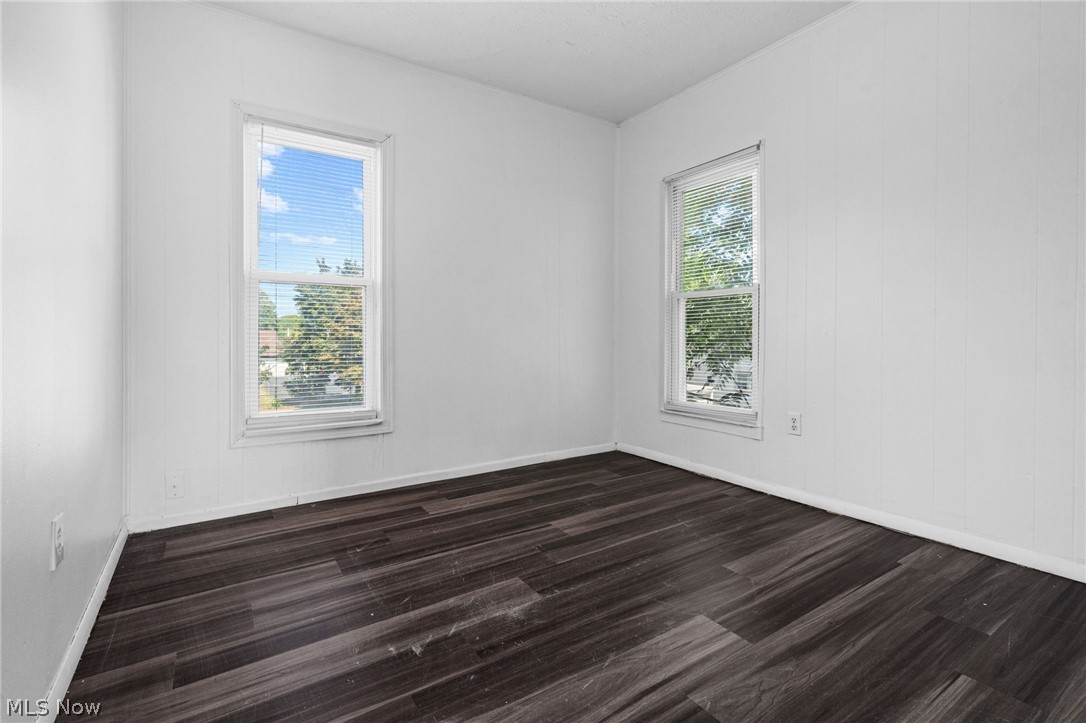 2387 29th Street Southwest Akron, OH 44314 - Photo 21 of 24 Unfurnished room featuring dark wood-style floors and baseboards