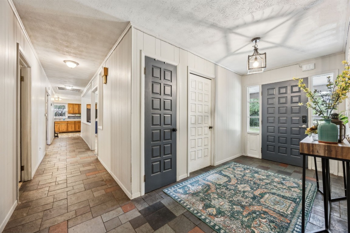 86071 Jones Road Yulee, FL 32097 - Photo 11 of 44 a view of a hallway with wooden floor and a livingroom