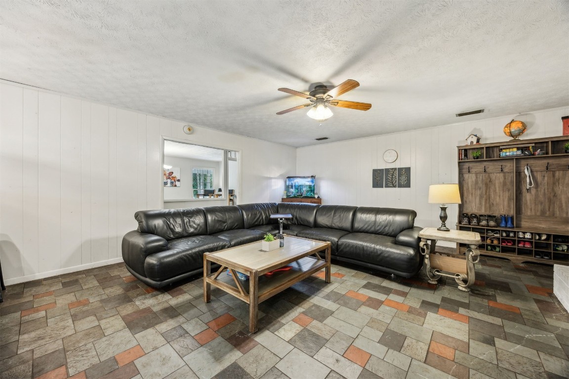 86071 Jones Road Yulee, FL 32097 - Photo 14 of 44 a living room with furniture a couch and a piano