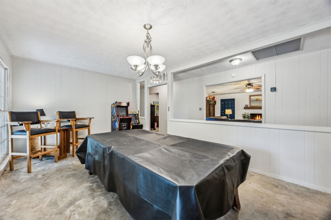 86071 Jones Road Yulee, FL 32097 - Photo 17 of 44 a living room with furniture and a chandelier