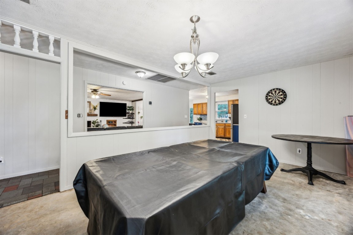 86071 Jones Road Yulee, FL 32097 - Photo 18 of 44 a kitchen with a table and chairs in it
