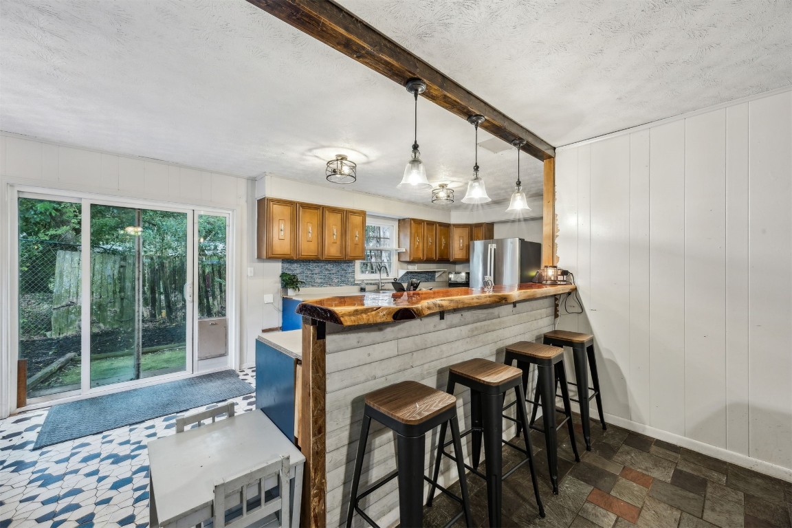 86071 Jones Road Yulee, FL 32097 - Photo 20 of 44 a view of a dining room with furniture window and wooden floor