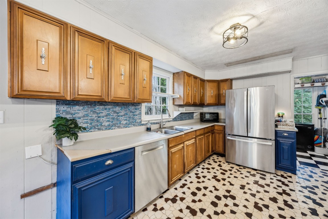 86071 Jones Road Yulee, FL 32097 - Photo 21 of 44 a kitchen with stainless steel appliances granite countertop a refrigerator sink and microwave