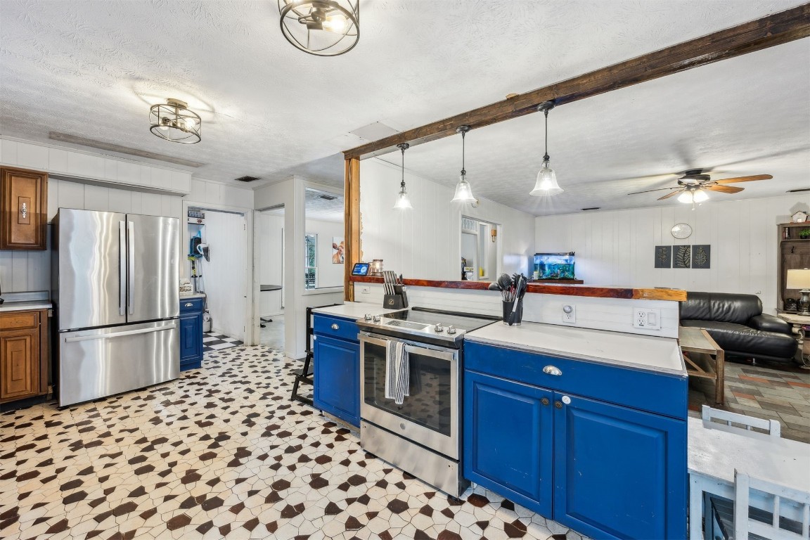 86071 Jones Road Yulee, FL 32097 - Photo 23 of 44 a kitchen with a sink stainless steel appliances and cabinets