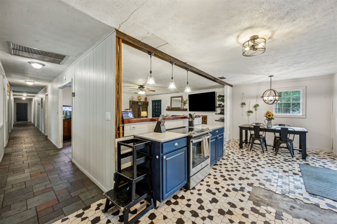 86071 Jones Road Yulee, FL 32097 - Photo 24 of 44 a kitchen with stainless steel appliances kitchen island granite countertop a sink and a refrigerator