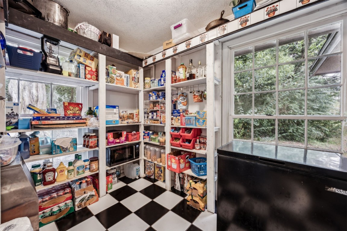 86071 Jones Road Yulee, FL 32097 - Photo 27 of 44 a room with lots of books and a large window