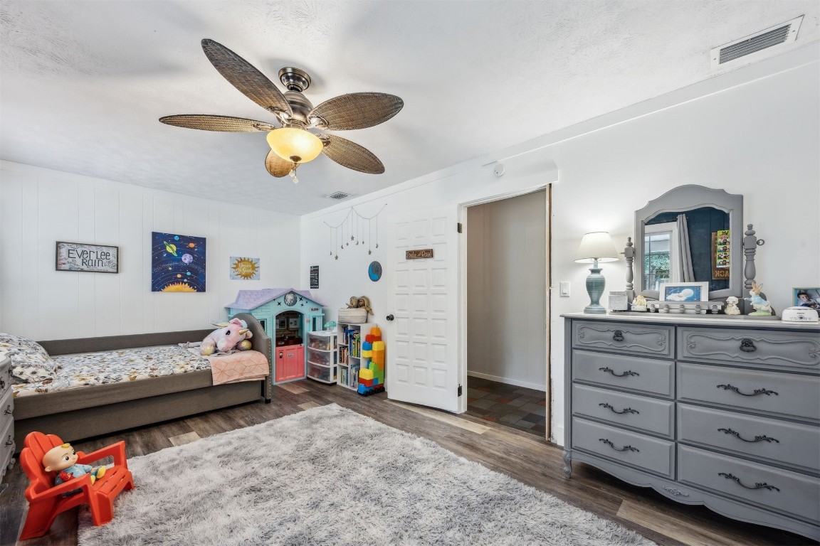 86071 Jones Road Yulee, FL 32097 - Photo 31 of 44 a bedroom with furniture and a mirror on dresser