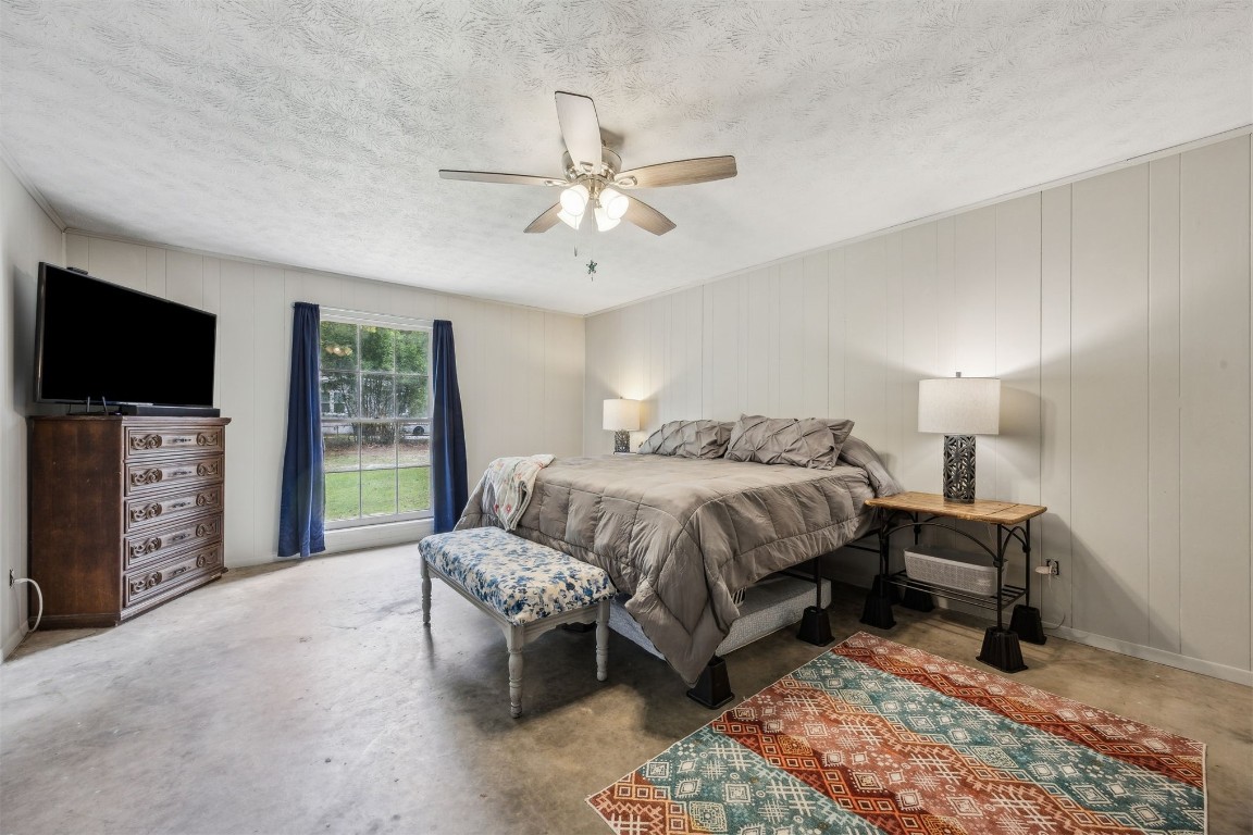 86071 Jones Road Yulee, FL 32097 - Photo 34 of 44 a bedroom with furniture and a flat screen tv