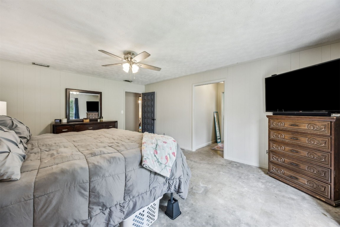 86071 Jones Road Yulee, FL 32097 - Photo 36 of 44 a bedroom with a bed and a flat screen tv