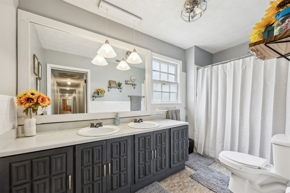86071 Jones Road Yulee, FL 32097 - Photo 37 of 44 a bathroom with a double vanity sink mirror and toilet