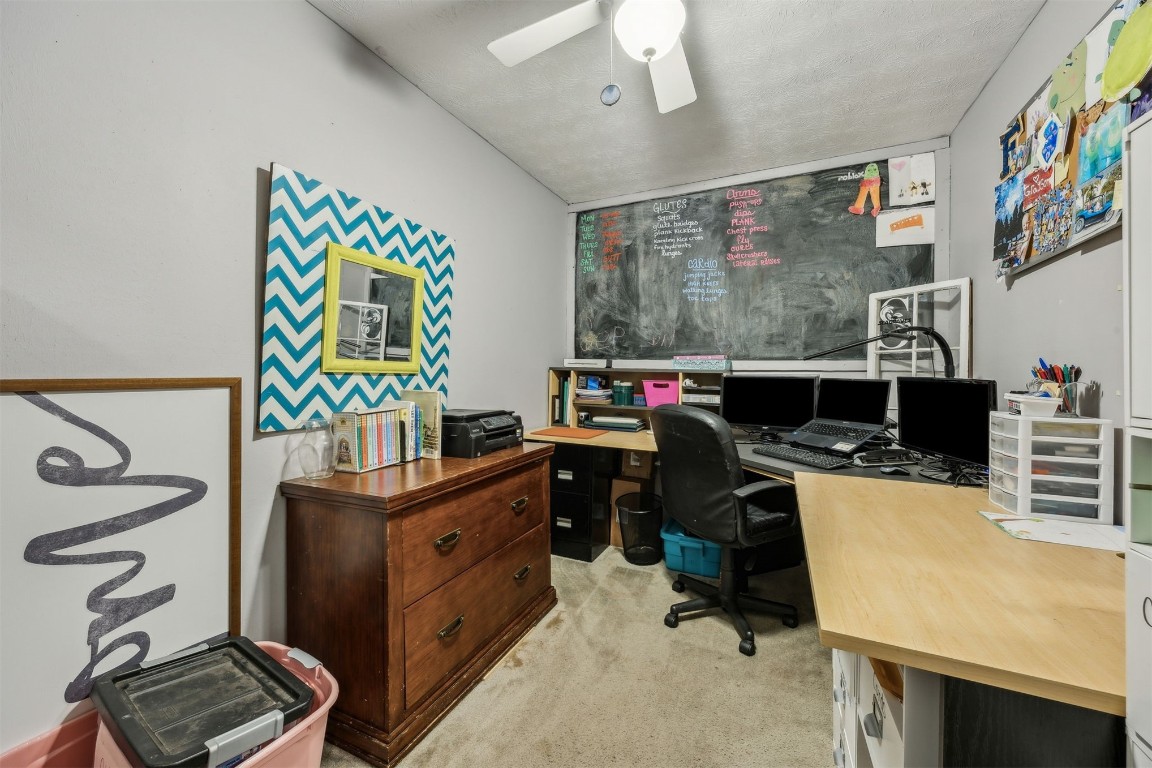 86071 Jones Road Yulee, FL 32097 - Photo 39 of 44 a view of a workspace with furniture and a flat screen tv
