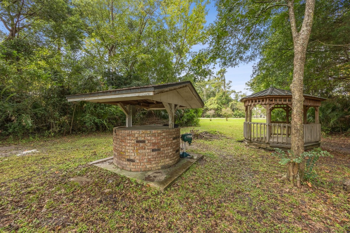 86071 Jones Road Yulee, FL 32097 - Photo 43 of 44 front view of a house with a yard