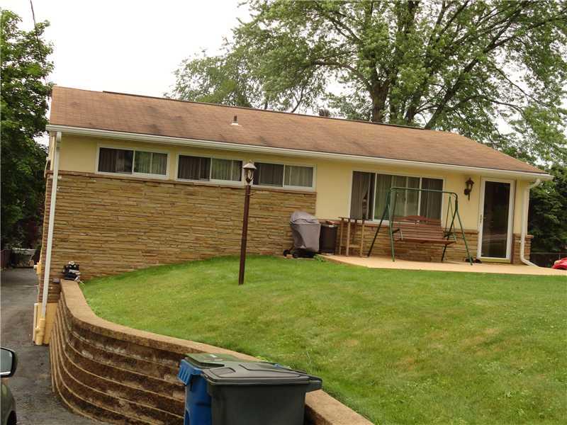 9952 Saltsburg Road Plum, PA 15239 - Photo 3 of 17 Exterior Front. New stone wall lines the driveway to rear of the house which entertains parking for numerouscars