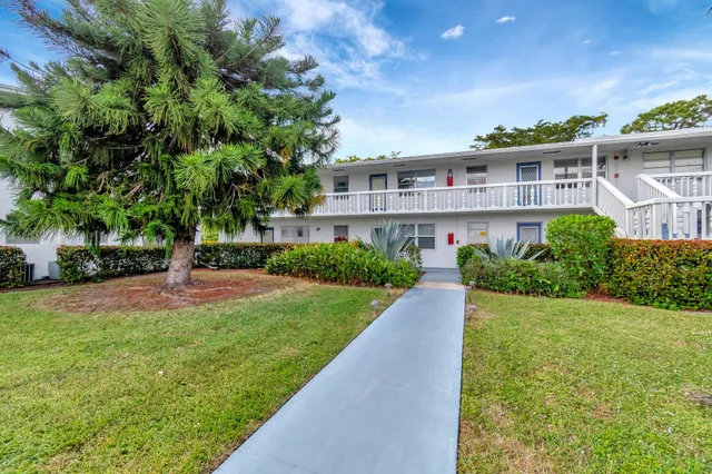 a view of a lake with houses in the back
