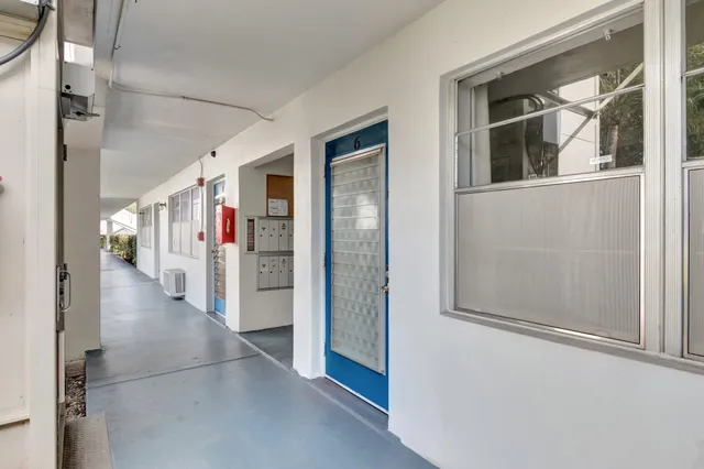 an aerial view of a house with a swimming pool outdoor seating