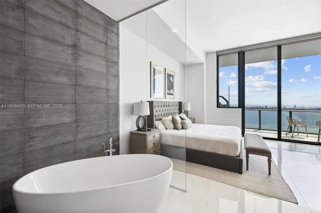 a bathroom with a double vanity sink and a bathtub