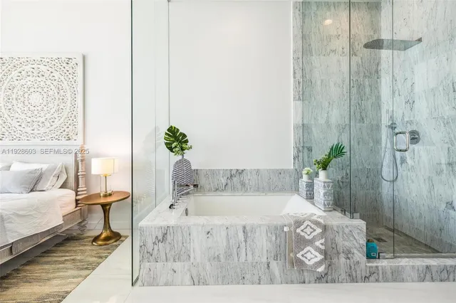 a spacious bedroom with a bed and a table