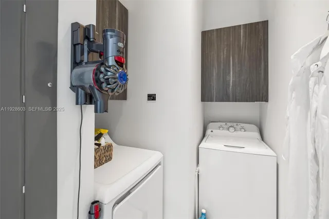 a utility room with dryer and washer