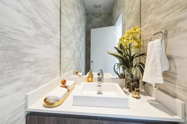 a bathroom with a sink and a mirror