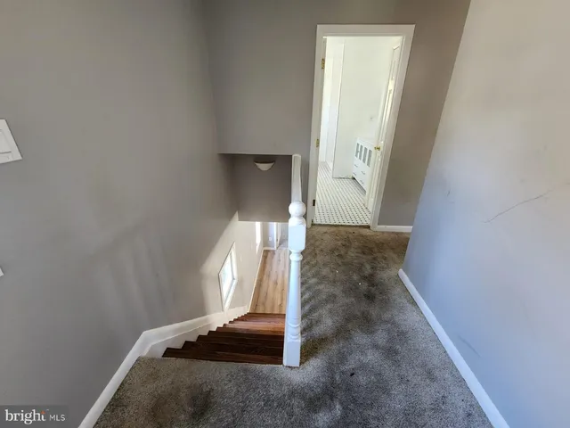 a view of a hallway with staircase