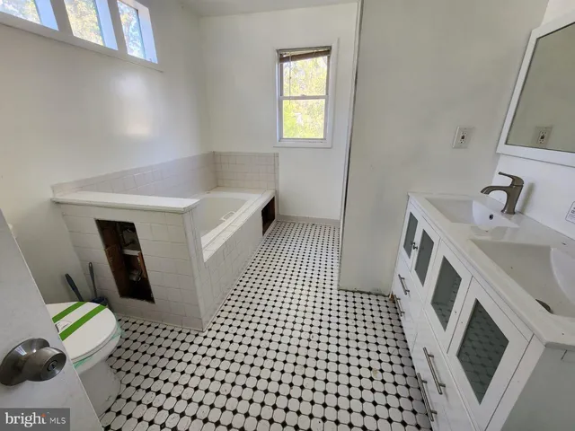 a view of a hallway with washer and dryer