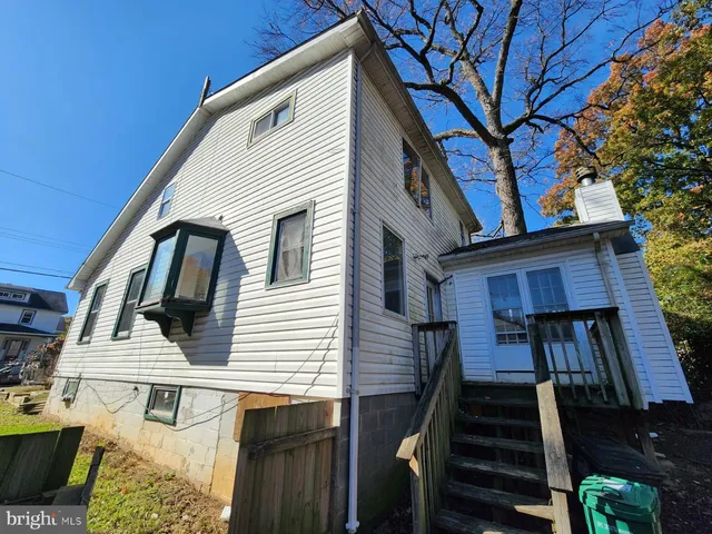 a view of a house with wooden stairs