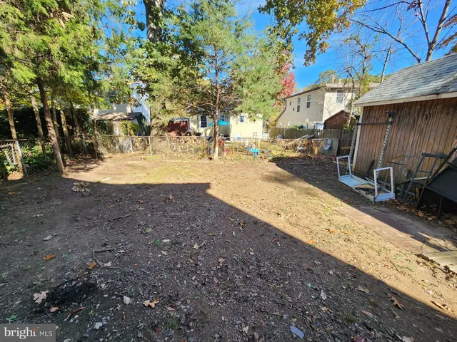 a view of a yard with car parked