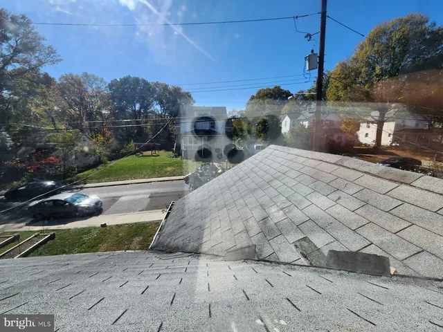 a view of a street with a building in the background