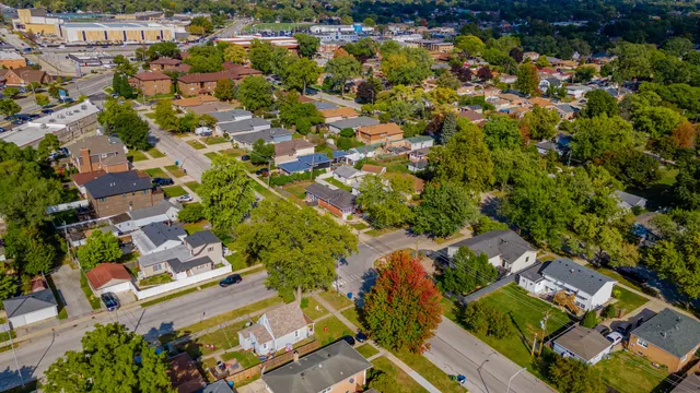 an aerial view of residential houses with outdoor space