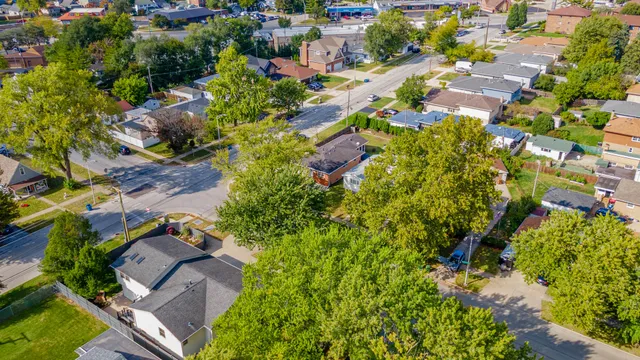 an aerial view of residential houses with outdoor space