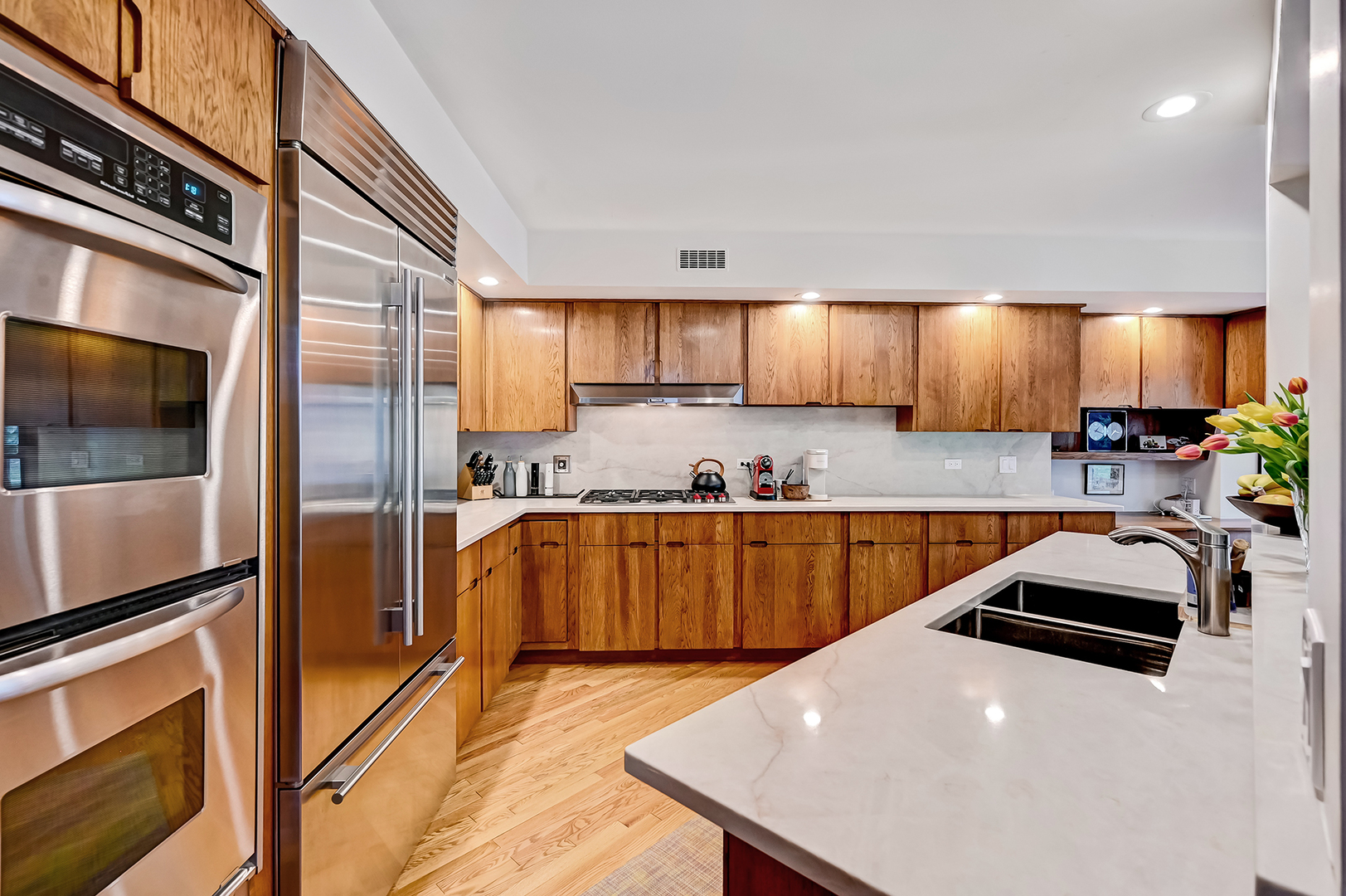 401 8th Place Hinsdale, IL 60521 - Photo 16 of 46 a kitchen with stainless steel appliances wooden cabinets a stove a sink and a refrigerator