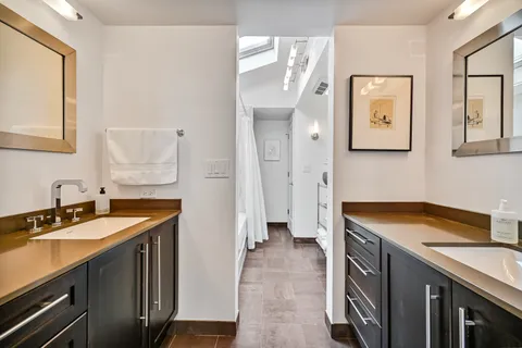a white bath tub sitting next to a white tub