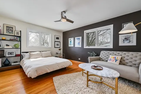 a living room with furniture a rug and a table
