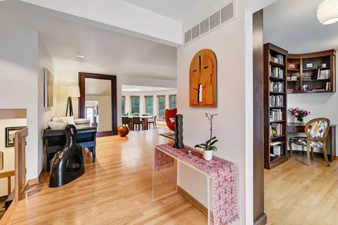 a view of living room filled with furniture and wooden floor