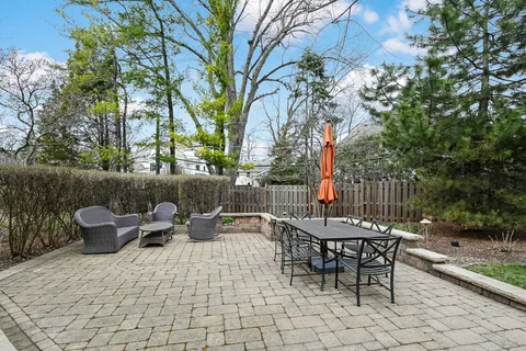 a view of a house with a yard and deck